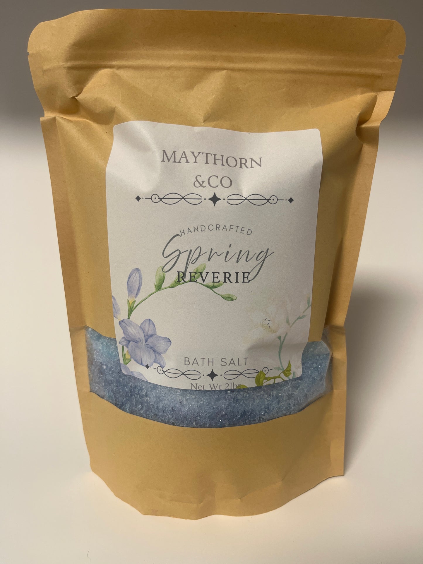 Maythorn & Co Spring Reverie bath salt in a glass jar with floral packaging and natural ingredients visible.