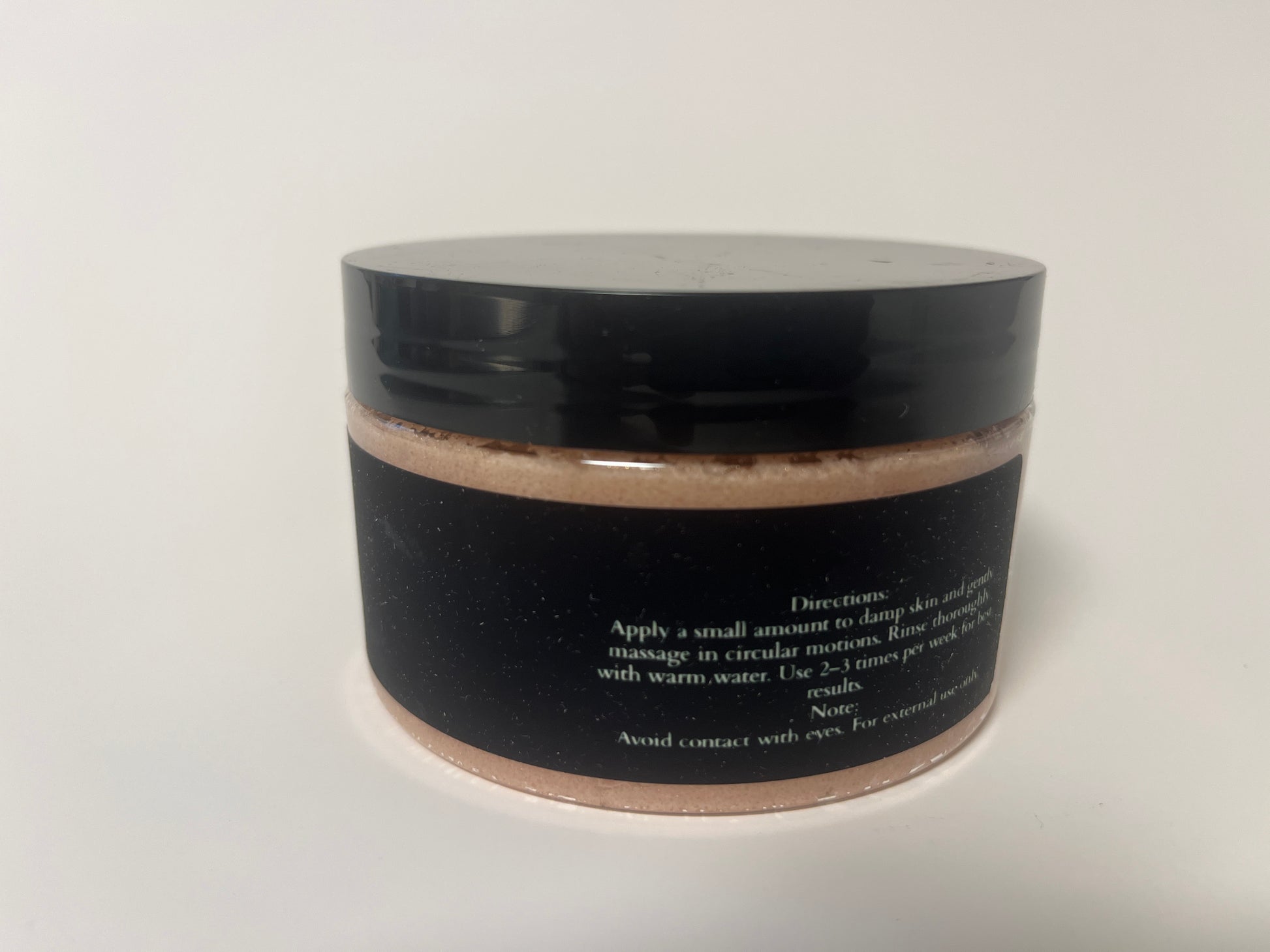 Maythorn & Co warm vanilla body scrub jar with textured scrub and vanilla scent, close-up view of the product container.