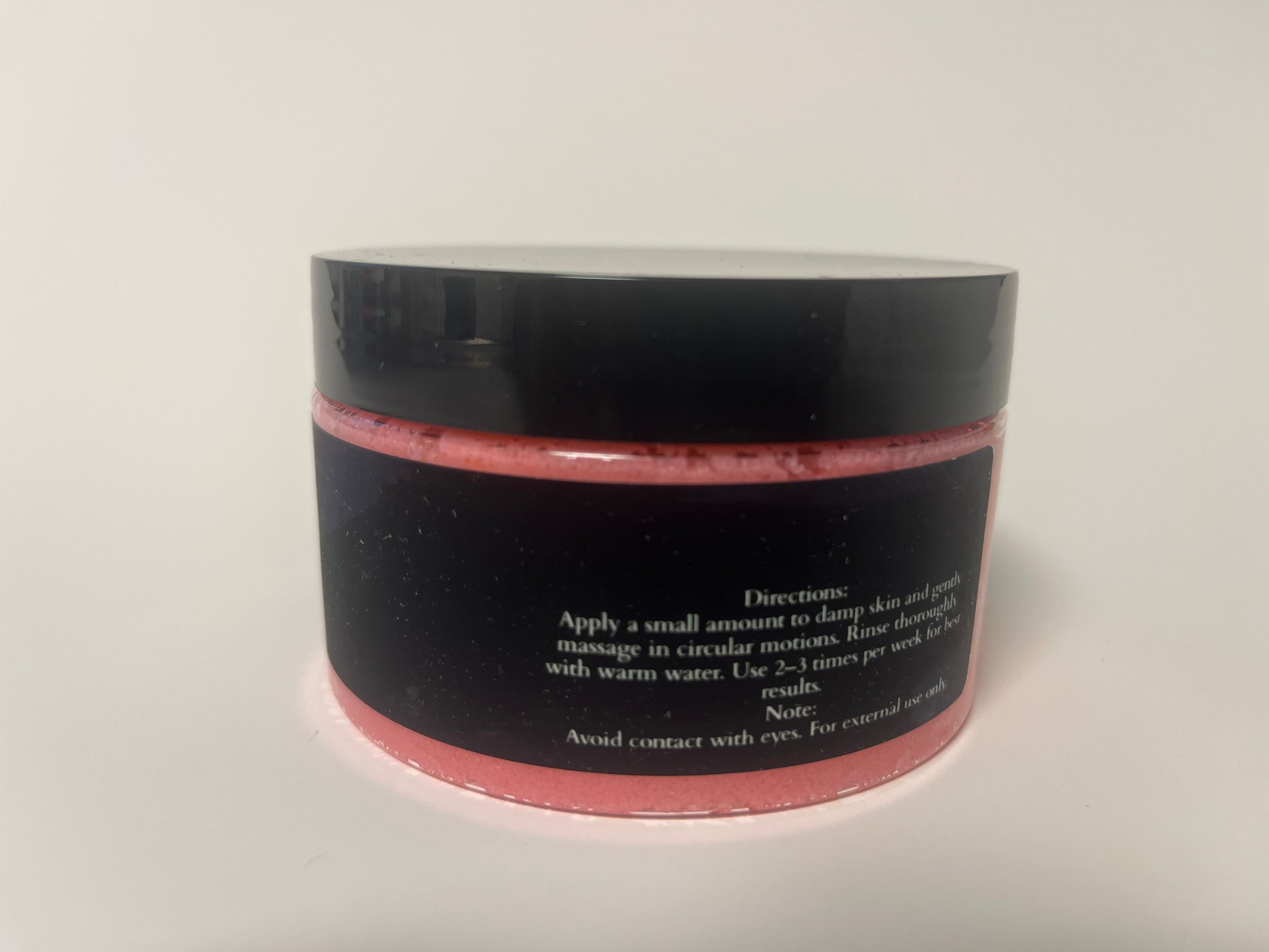 Maythorn & Co Strawberry Citrus Body Scrub jar with textured pink and orange scrub, showcasing natural ingredients and fresh fruit scents.
