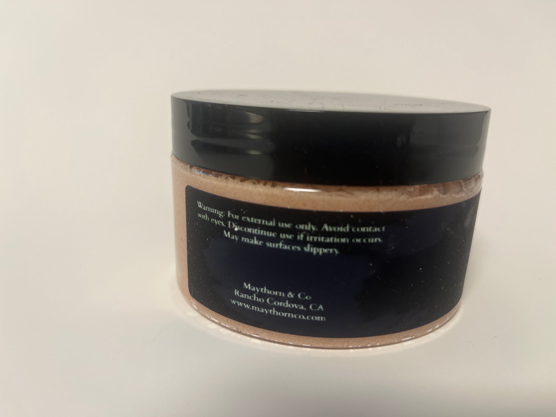 Maythorn & Co Warm Vanilla Body Scrub jar with textured vanilla-scented exfoliating scrub visible inside.