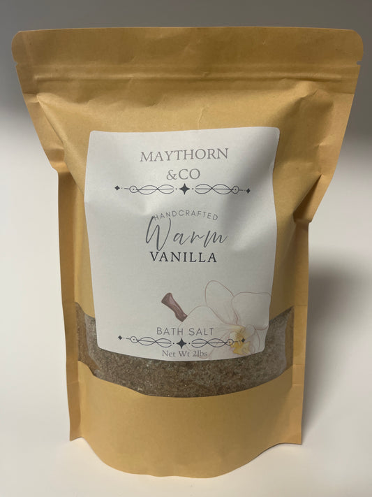 Warm Vanilla bath salt from Maythorn & Co in a clear jar, showing creamy vanilla-scented bath salts with a rustic label.